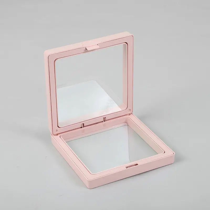 Cadre flottant 3D rose ouvert avec deux membranes transparentes sur fond gris