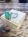 Bague émeraude carré sertis clos