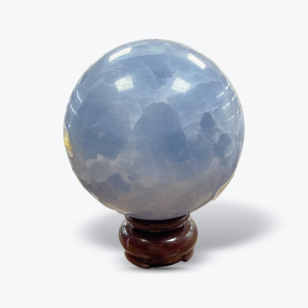 Sphère en Calcite Bleue Naturelle polie, sur socle en bois – 7 à 8 cm