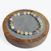 Bracelet Super Seven perles 6 mm avec décors dorée