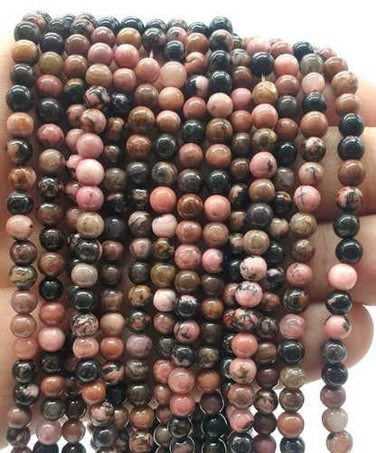 Perles 'Black Line' Rhodonite sur fil