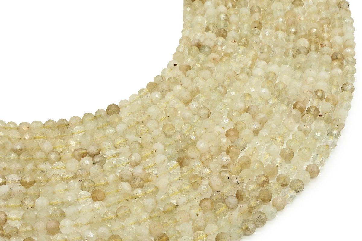 Fils de perles facettées de Citrine naturelle jaune pâle posés côte à côte