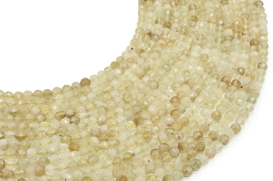 Fils de perles facettées de Citrine naturelle jaune pâle posés côte à côte