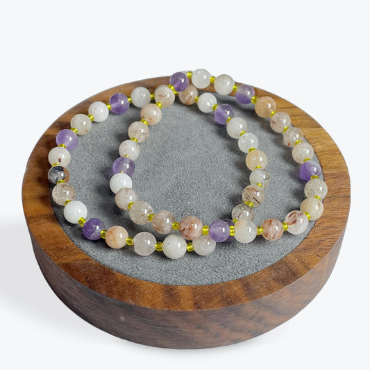 Bracelet Super Seven perles 6 mm avec décors dorée