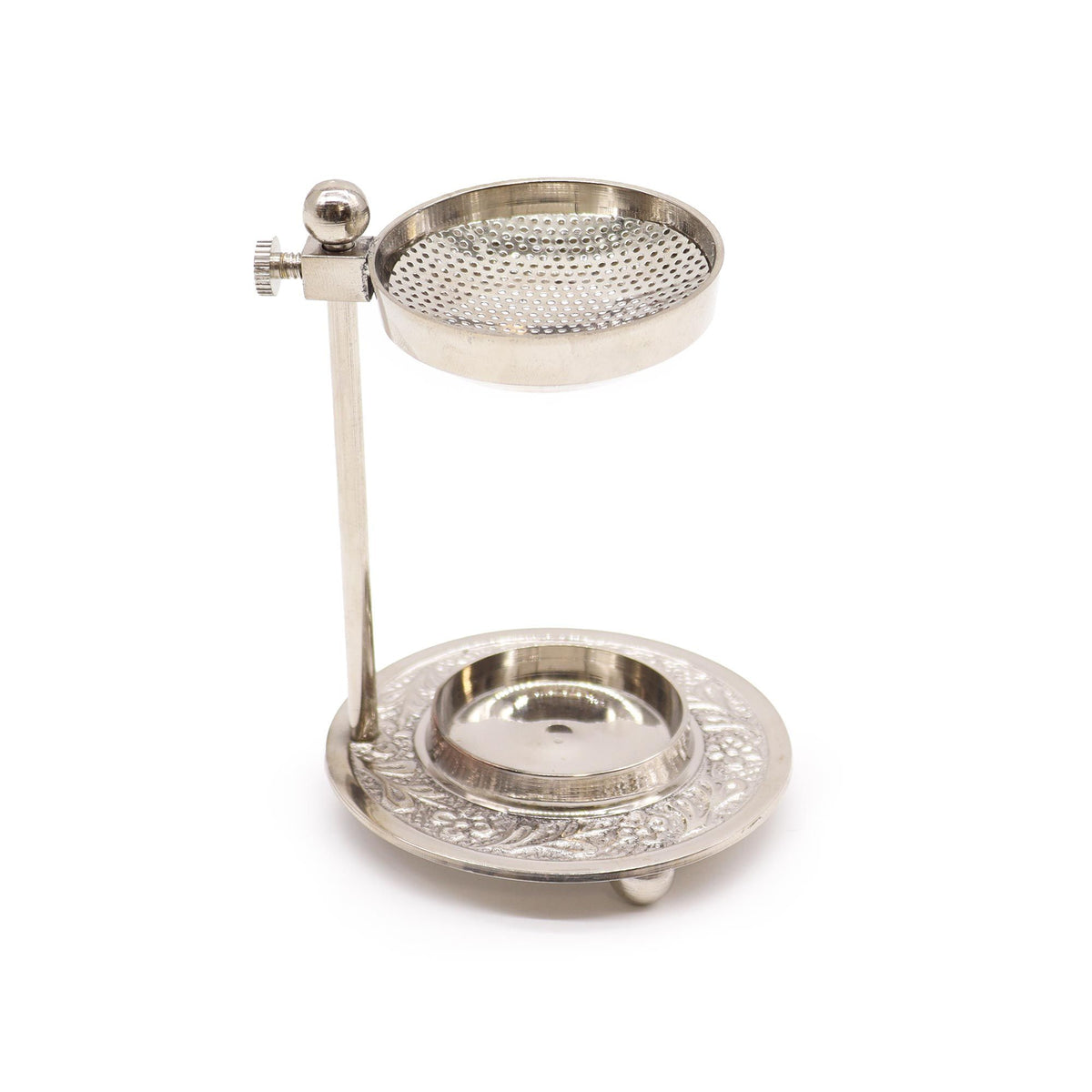 Réchaud à résine argenté avec grille perforée réglable et socle ciselé pour bougie