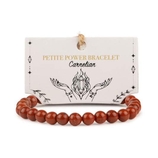 Bracelet de perles rondes en jaspe rouge devant sa carte de présentation illustrée