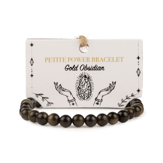 Bracelet en perles d'obsidienne dorée posé devant sa carte de présentation illustrée