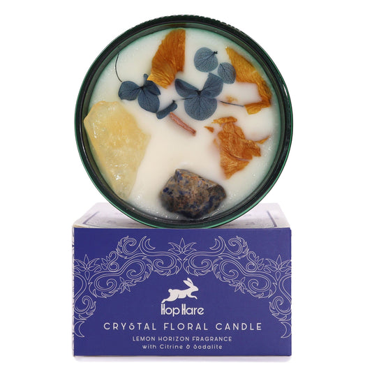 Bougie en pot vert ornée de citrine, sodalite et fleurs séchées sur sa boîte