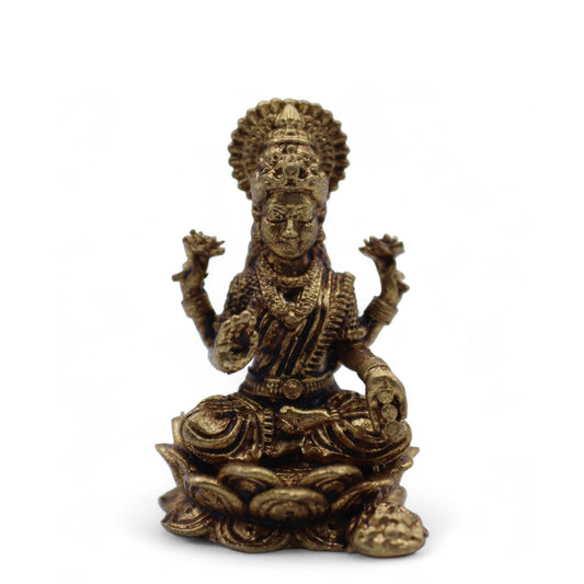 Statuette miniature de la déesse Lakshmi en laiton doré assise sur un lotus
