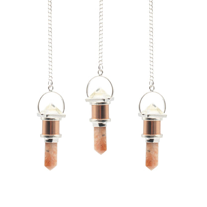 Pendule cuivre Cristal de roche et Pierre de soleil